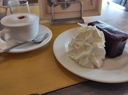 Cup of coffee and chocolate cake. Photo. 