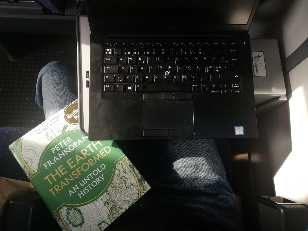 Laptop and book. Photo.