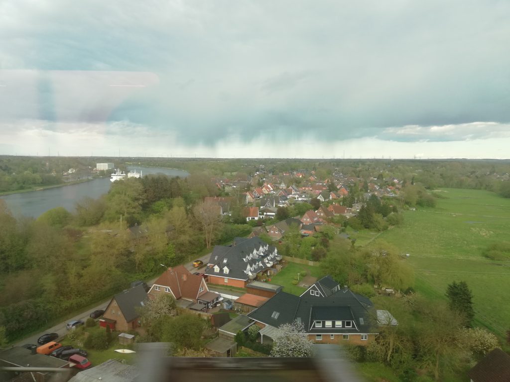 View over village and grey sky. Photo. 