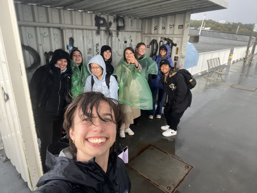  ClimBEco participants covering from the rain. Photo.